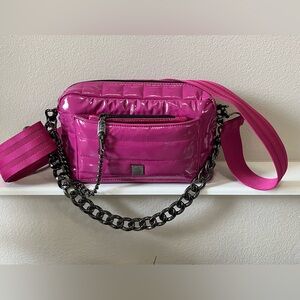 Think Royln Margo Crossbody in
Fuchsia.